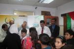 بالصور:جمعية الزيتونة توزع الحقائب المدرسية في محافظة نابلس